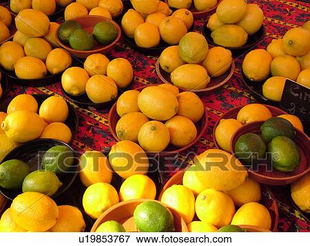 Stock Photo -  France, Lyon, Rhone-Alpes, Europe, downtown, City Market, limes, lemons. Fotosearch