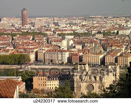 Stock Photo -  France, Lyon, Rhone-Alpes, Europe, Saone River, aerial view of downtown Lyon from Fourviere Hill, Cathedrale St Jean, Credit Lyonnais Building. Fotosearch
