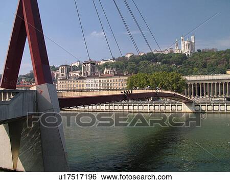 Stock Photograph -  France, Lyon, Rhone-Alpes, Europe, pedestrian bridge, Saone River. Fotosearch