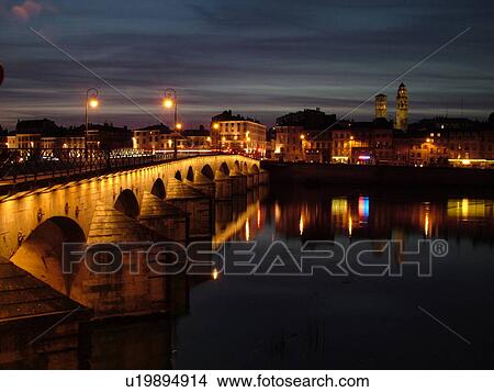 Picture -  France, Macon, Burgundy, Saone et Loire, Europe, Saone River, The 11th century Pont de St-Laurent, evening. Fotosearch