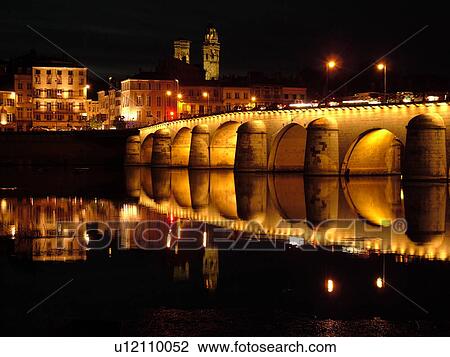 Stock Image -  France, Macon, Burgundy, Saone et Loire, Europe, Saone River, The 11th century Pont de St-Laurent, evening. Fotosearch