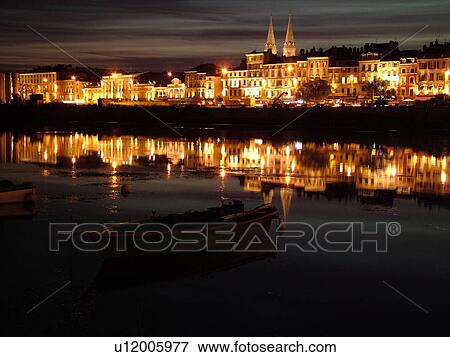Stock Photo -  France, Macon, Burgundy, Saone et Loire, Europe, Saone River, evening, reflection. Fotosearch