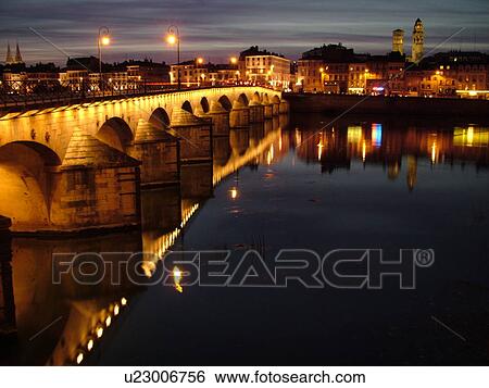 Stock Photograph -  France, Macon, Burgundy, Saone et Loire, Europe, Saone River, The 11th century Pont de St-Laurent, evening. Fotosearch
