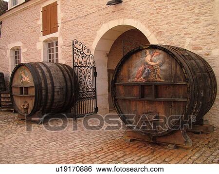 Stock Photograph -  France, Pommard, Burgundy, Cote de Beaune, Cote d'Or, Europe, Burgundy Wine Region, Chateau Pommard, antique wine barrels. Fotosearch