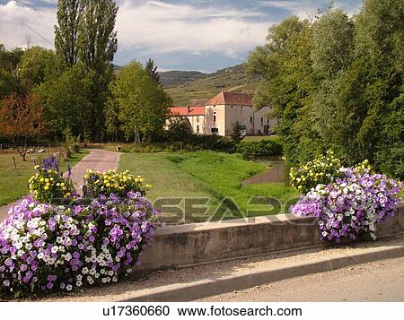 Stock Image -  France, Santenay, Burgundy, Cote de Beaune, Cote d'Or, Europe, Burgundy Wine Region, bridge decorated with flowers. Fotosearch