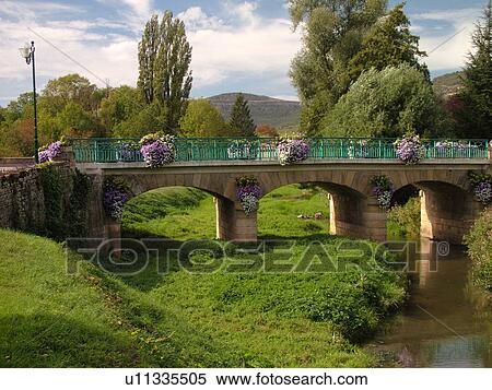 Stock Photography -  France, Santenay, Burgundy, Cote de Beaune, Cote d'Or, Europe, Burgundy Wine Region, bridge decorated with flowers. Fotosearch