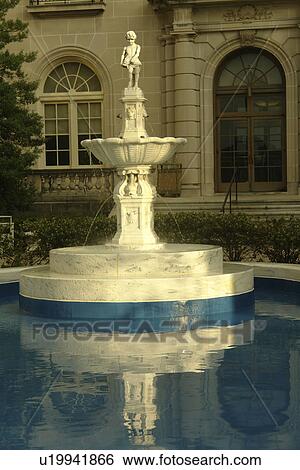 Stock Photograph -  Hershey, PA, Pennsylvania, Hershey Park, Fountain and blue pool in front of building . Fotosearch