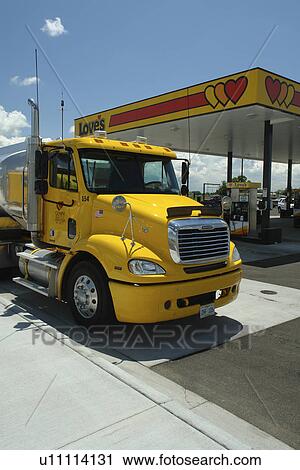 Heyburn, ID, Idaho, I-84, gas station, yellow Freightliner cab, truck, 18-wheeler, tanker View Large Photo Image Stock Image - Heyburn, ID, Idaho, I-84, gas station, yellow Freightliner cab, truck, 18-wheeler, tanker. Fotosearch