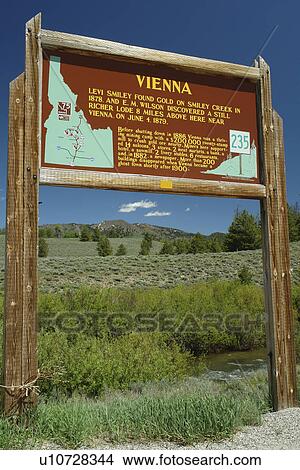 Picture -  ID, Idaho, Sawtooth National Recreation Area, Sawtooth National Forest, Sawtooth Valley and Smiley Creek, Vienna wooden road sign, historical marker. Fotosearch