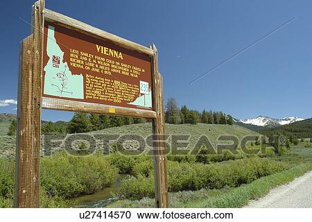 Stock Image -  ID, Idaho, Sawtooth National Recreation Area, Sawtooth National Forest, Sawtooth Valley and Smiley Creek, Vienna wooden road sign, historical marker. Fotosearch