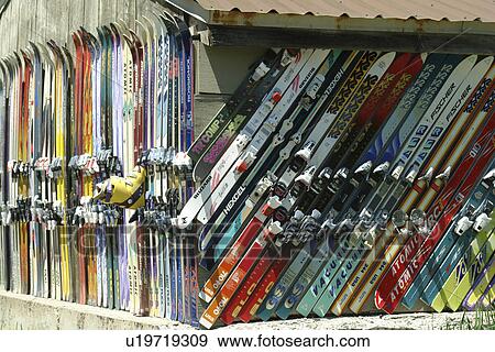 Stock Photo -  Ketchum, Sun Valley, ID, Idaho, outside of shed aligned with a collection of downhill skis. Fotosearch