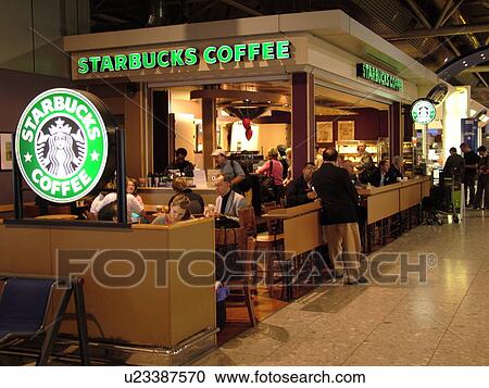 Stock Image -  London, Great Britain, England, Europe, United Kingdom, Heathrow International Airport, airport terminal, hub, Starbucks Coffee. Fotosearch