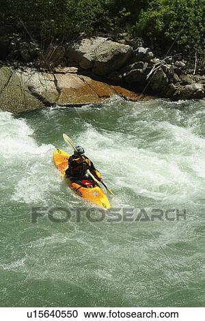 Stock Image -  Lowman, ID, Idaho, Boise National Forest, Ponderosa Pine Scenic Byway, Sawtooth Range, South Fork Payette River, whitewater kayaking. Fotosearch