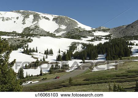 Stock Image -  Medicine Bow National Forest, WY, Wyoming, Snowy Range Pass, Snowy Range Scenic Byway, mountain road. Fotosearch