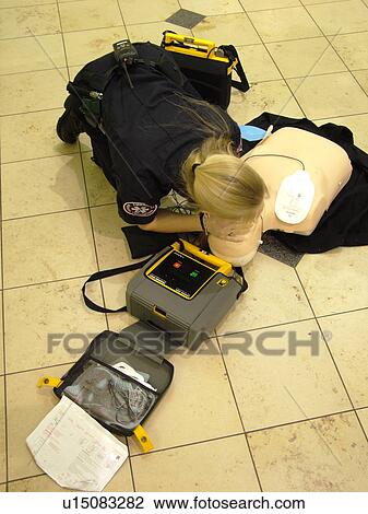 Stock Image -  Minneapolis, MN, Minnesota, Minneapolis International Airport, CPR training, demonstration, airport terminal, hub. Fotosearch