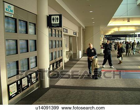 Stock Photo -  Minneapolis, MN, Minnesota, Minneapolis International Airport, airport information, flight arrivals and departure monitors, airport terminal, hub. Fotosearch