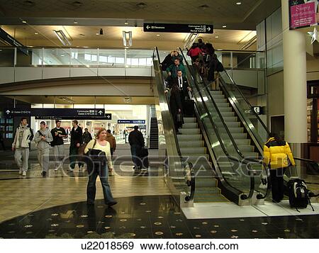 Stock Photo -  Minneapolis, MN, Minnesota, Minneapolis International Airport, escalators, airport terminal, hub. Fotosearch