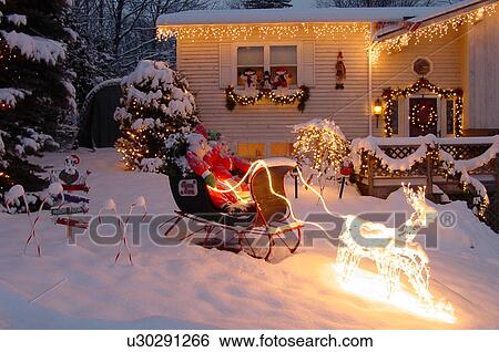 Montpelier, VT, Vermont, Christmas decorations, Santa and Mrs. Claus in sleigh pulled by lighted reindeer, home, lights, festive View Large Photo Image Stock Photograph - Montpelier, VT, Vermont, Christmas decorations, Santa and Mrs. Claus in sleigh pulled by lighted reindeer, home, lights, festive. Fotosearch
