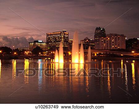 Orlando, FL, Florida, Lake Lucerne, skyline, downtown, evening, illuminated fountain View Large Photo Image Stock Photo - Orlando, FL, Florida, Lake Lucerne, skyline, downtown, evening, illuminated fountain. Fotosearch