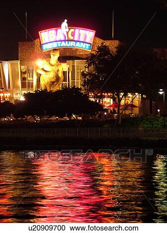 Stock Image -  Orlando, FL, Florida, Universal Orlando Resort, Universal City Walk, NBA City Restaurant, evening. Fotosearch
