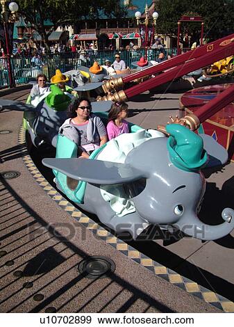 Stock Photo -  Orlando, FL, Florida, Walt Disney World Resort, Magic Kingdom Park, Dumbo The Flying Elephant Ride, carousel (Editorial Use Only). Fotosearch