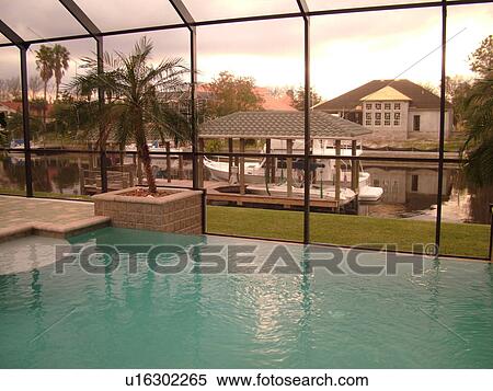 Stock Photography -  Palm Coast, FL, Florida, infinity swimming pool, intracoastal waterway. Fotosearch