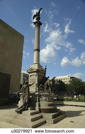 Stock Image -  Peoria, IL, Illinois, Caterpillar Building, downtown, Civil War Monument, granite statue. Fotosearch