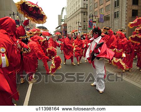 Philadelphia, PA, Pennsylvania, downtown, New Years Day, Philadelphia Annual Mummer's Day Parade, 2006, Comic Division, Elvis, men in red dresses with umbrellas, satan, devils View Large Photo Image Picture -  Philadelphia, PA, Pennsylvania, downtown, New Years Day, Philadelphia Annual Mummer's Day Parade, 2006, Comic Division, Elvis, men in red dresses with umbrellas, satan, devils. Fotosearch