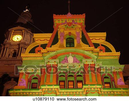 Stock Image -  Philadelphia, PA, Pennsylvania, downtown, evening, City Hall, colorful lights on building. Fotosearch