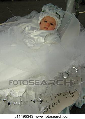 Philadelphia, PA, Pennsylvania, downtown, New Years Day, Philadelphia Annual Mummer's Day Parade, 2006, Comic Division, Anne Geddes Littlest Angel, baby in bassinet with umbrella View Large Photo Image Stock Image - Philadelphia, PA, Pennsylvania, downtown, New Years Day, Philadelphia Annual Mummer's Day Parade, 2006, Comic Division, Anne Geddes Littlest Angel, baby in bassinet with umbrella. Fotosearch