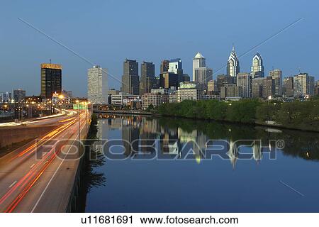 Stock Image -  Philadelphia, PA, Pennsylvania, Schuylkill River, Downtown Skyline, I-76, evening, reflection, expressway. Fotosearch