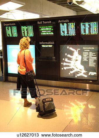 Philadelphia, PA, Pennsylvania, Philadelphia International Airport, airport information, woman looking at flight arrivals and departure monitors, airport terminal, hub View Large Photo Image Stock Image - Philadelphia, PA, Pennsylvania, Philadelphia International Airport, airport information, woman looking at flight arrivals and departure monitors, airport terminal, hub. Fotosearch