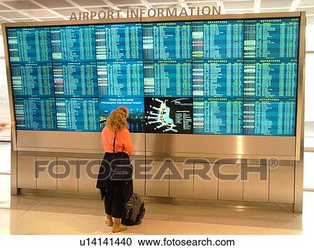 Philadelphia, PA, Pennsylvania, Philadelphia International Airport, airport information, woman looking at flight arrivals and departure monitors, airport terminal, hub View Large Photo Image Stock Image - Philadelphia, PA, Pennsylvania, Philadelphia International Airport, airport information, woman looking at flight arrivals and departure monitors, airport terminal, hub. Fotosearch