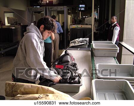 Stock Image -  Philadelphia, PA, Pennsylvania, Philadelphia International Airport, airport security, checking, terminal. Fotosearch