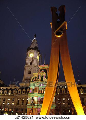Stock Image -  Philadelphia, PA, Pennsylvania, downtown, evening, City Hall, Clothes Pin statue, colorful lights on building. Fotosearch
