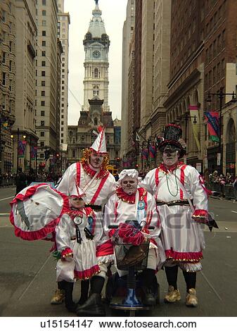 Stock Photo -  Philadelphia, PA, Pennsylvania, downtown, City Hall, New Years Day, Philadelphia Annual Mummer's Day Parade, 2006, Comic Division, four generations, great-grandfather, grandfather, father, son, men and boys in dresses, . Fotosearch