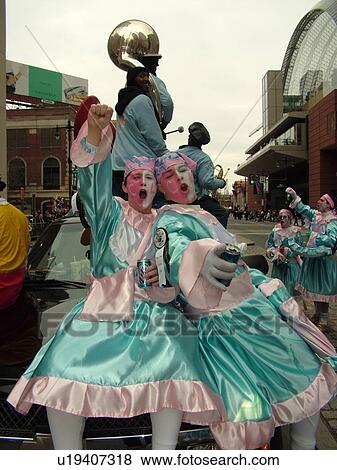 Stock Photo -  Philadelphia, PA, Pennsylvania, downtown, New Years Day, Philadelphia Annual Mummer's Day Parade, 2006, Royal Brass Band, comic division, men in blue and pink dresses singing. Fotosearch