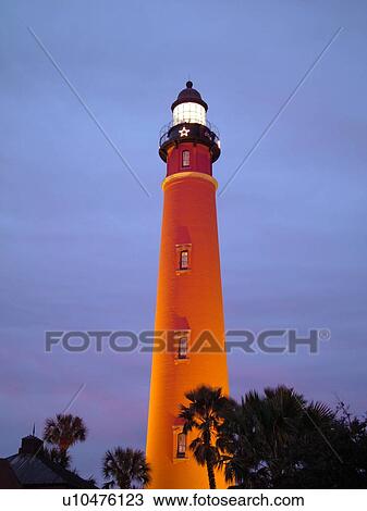 Stock Image -  Ponce Inlet, Daytona Beach, FL, Florida, Atlantic Ocean, Ponce De Leon Inlet Light Station, lighthouse, evening. Fotosearch