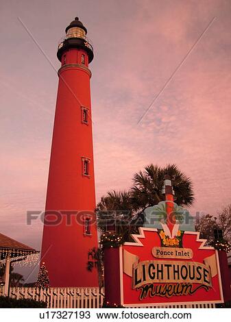 Stock Image -  Ponce Inlet, Daytona Beach, FL, Florida, Atlantic Ocean, Ponce De Leon Inlet Light Station, lighthouse, museum, entrance sign, sunset. Fotosearch