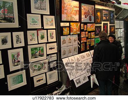 Stock Image -  Quebec City, Quebec, Canada, Artwork displayed on Rue Du Tresor in Old Quebec City in Quebec, street artists, paintings. Fotosearch