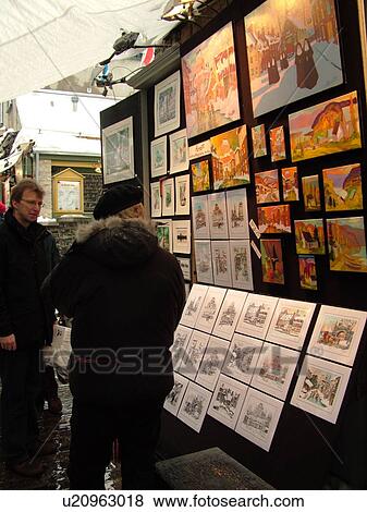 Stock Photo -  Quebec City, Quebec, Canada, Artwork displayed on Rue Du Tresor in Old Quebec City in Quebec, street artists, paintings. Fotosearch