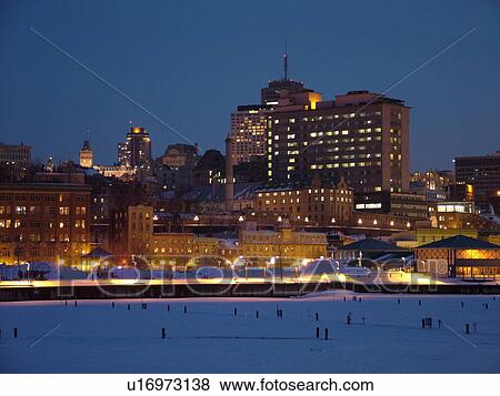 Stock Photo -  Quebec City, Quebec, Canada, Vieux Port (Old Port), St. Lawrence River (Fleuve Saint-Laurent), downtown, skyline, evening. Fotosearch