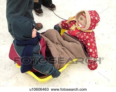 Quebec City, Quebec, Canada, Winter Carnival 2006, snow, toddler and baby bundled up in plastic sled View Large Photo Image Stock Image - Quebec City, Quebec, Canada, Winter Carnival 2006, snow, toddler and baby bundled up in plastic sled. Fotosearch