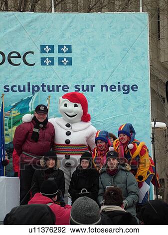 Stock Image -  Quebec City, Quebec, Canada, Winter Carnival 2006, Bonhomme the carnival mascot, Award ceremony for the snow sculpture competition. Fotosearch