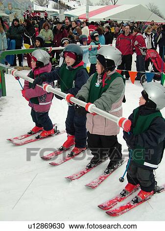 Stock Image -  Quebec City, Quebec, Canada, Winter Carnival 2006, Place Desjardens, children's ski ride. Fotosearch