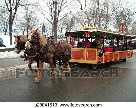 Stock Image -  Quebec City, Quebec, Canada, Winter Carnival 2006, horse-drawn covered carriage rides, wagon. Fotosearch