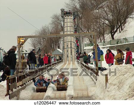 Stock Photo -  Quebec City, Quebec, Canada, Winter Carnival 2006, Toboggan Run at Terrasse Dufferin (Dufferin Terrace) in Vieux Quebec (Old Quebec).. Fotosearch