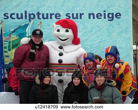Stock Photo -  Quebec City, Quebec, Canada, Winter Carnival 2006, Bonhomme the carnival mascot, Award ceremony for the snow sculpture competition. Fotosearch