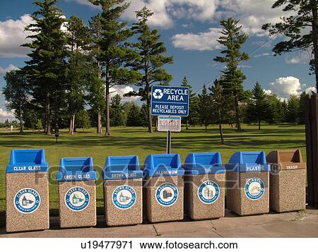 Stock Image -  Recycling Area, recycle containers with blue tops. Fotosearch