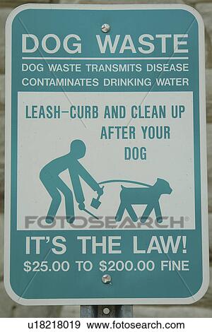Stock Photo -  road signs, Dog Waste, Leash-Curb and Clean-up After Your Dog, It's the Law. Fotosearch